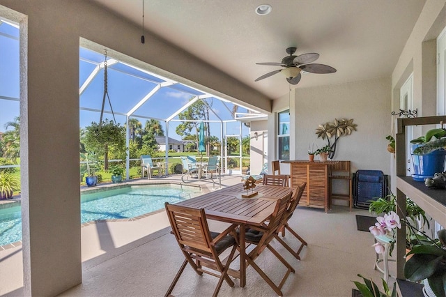 exterior space featuring ceiling fan, a lanai, and a patio