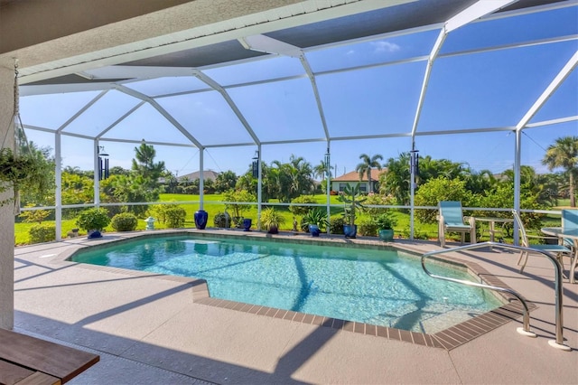 view of swimming pool with a lanai and a patio area