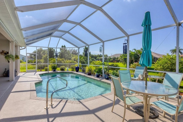 view of pool featuring a patio and a lanai