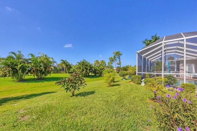 view of yard with a lanai