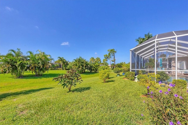 view of yard featuring a lanai