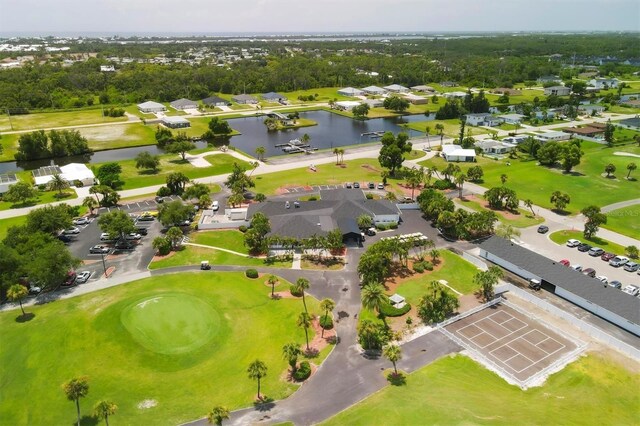 birds eye view of property with a water view and a residential view