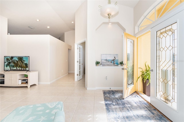 entryway featuring recessed lighting, visible vents, baseboards, and light tile patterned floors