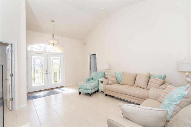 living room featuring light tile patterned floors, high vaulted ceiling, and french doors