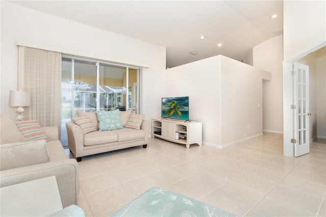 tiled living room with high vaulted ceiling