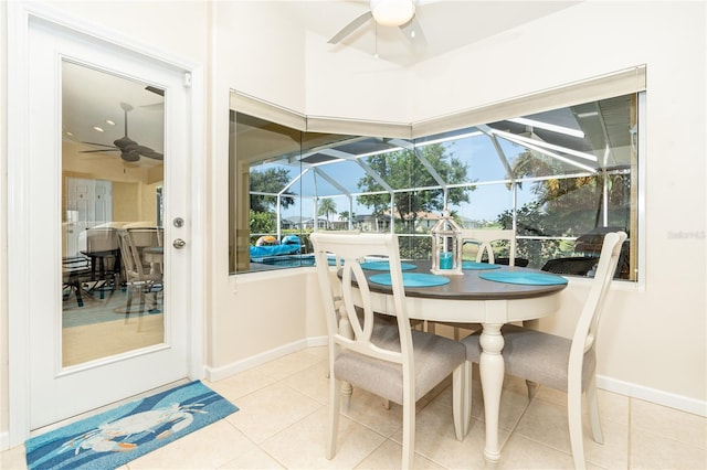 tiled dining room featuring ceiling fan