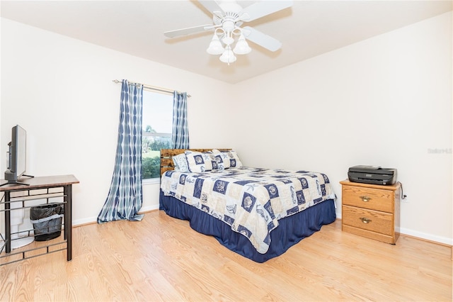 bedroom featuring light hardwood / wood-style flooring and ceiling fan