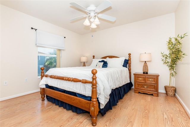 bedroom with light wood-type flooring and ceiling fan