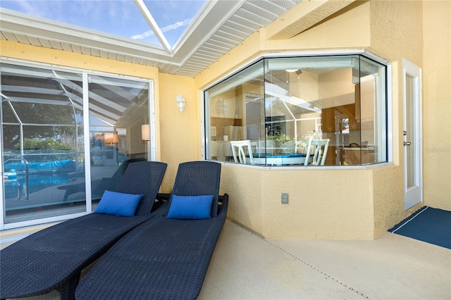 view of patio with a lanai