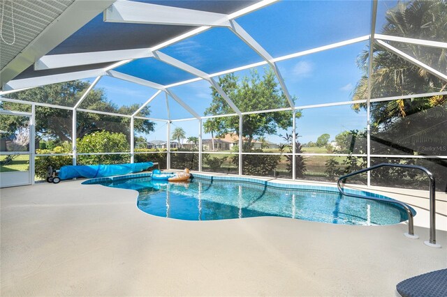 view of pool featuring a patio area and a lanai