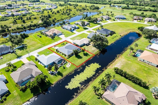 bird's eye view with a water view and a residential view