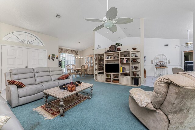 living room featuring high vaulted ceiling, carpet floors, and ceiling fan with notable chandelier