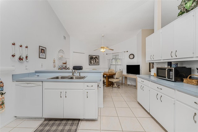 kitchen featuring ceiling fan, vaulted ceiling, white cabinetry, white dishwasher, and sink