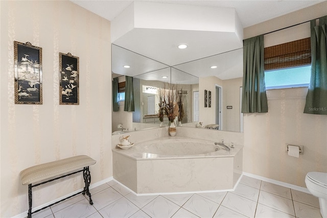 bathroom with toilet, tile patterned floors, and a tub to relax in