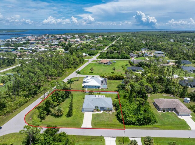 birds eye view of property featuring a water view