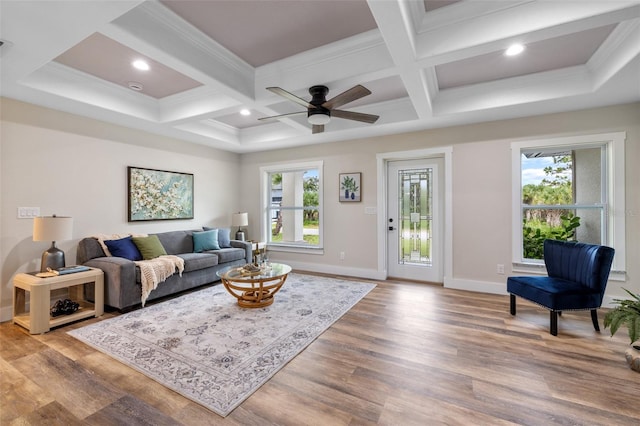 living room featuring wood-type flooring, a wealth of natural light, and coffered ceiling