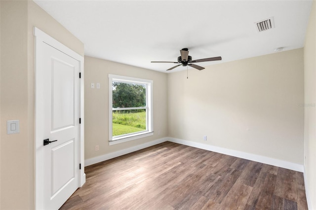 empty room with ceiling fan and wood-type flooring