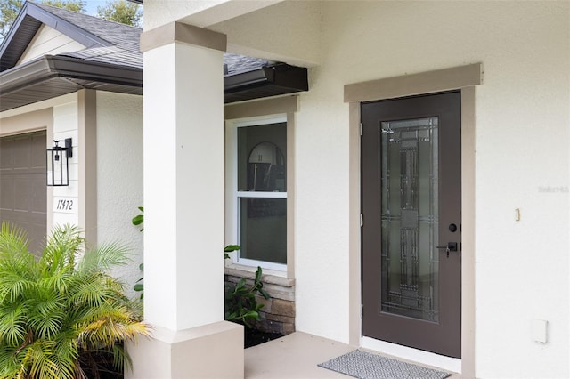 entrance to property featuring a garage