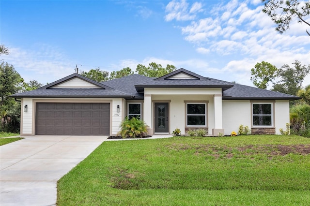 view of front of house with a front yard and a garage