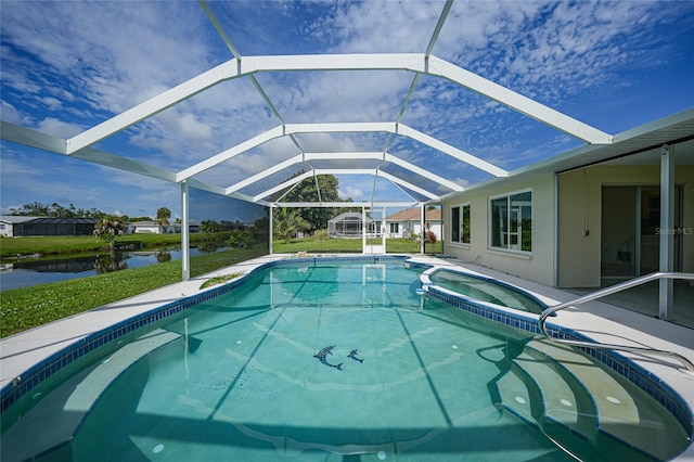 view of swimming pool featuring a water view, glass enclosure, a pool with connected hot tub, and a patio