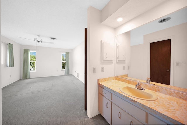 bathroom featuring visible vents, ceiling fan, and vanity