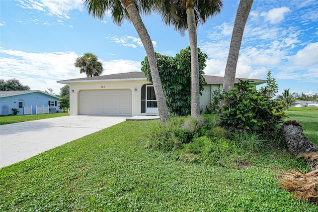 view of front of property featuring a garage, concrete driveway, a front lawn, and stucco siding