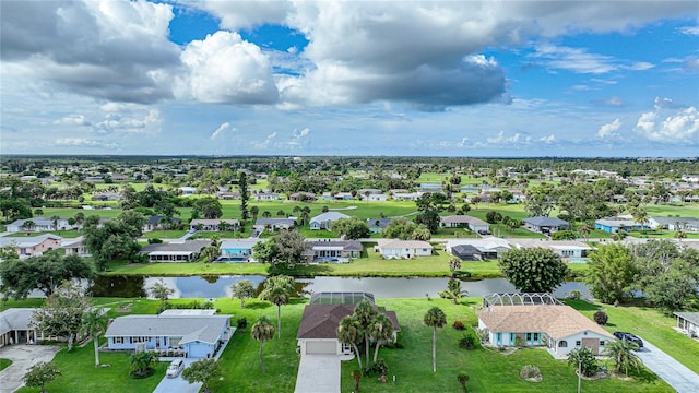 aerial view featuring a water view and a residential view