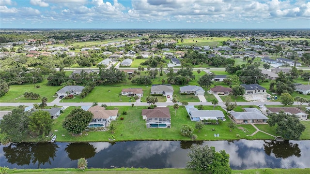 aerial view featuring a residential view and a water view