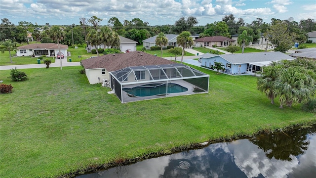 birds eye view of property with a water view and a residential view