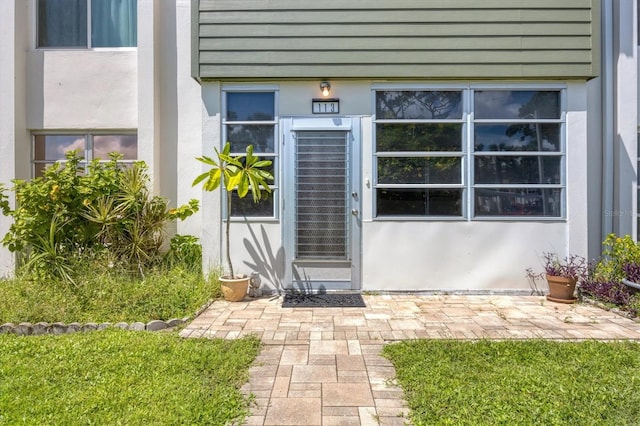 entrance to property featuring a patio area