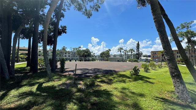 view of property's community with a lawn