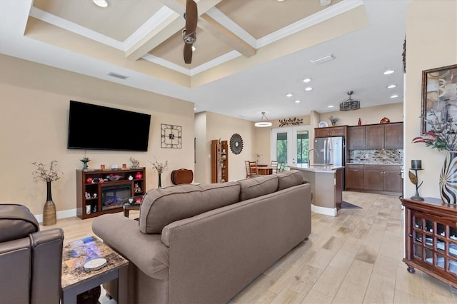 living room with light wood-type flooring, french doors, beamed ceiling, ceiling fan, and coffered ceiling