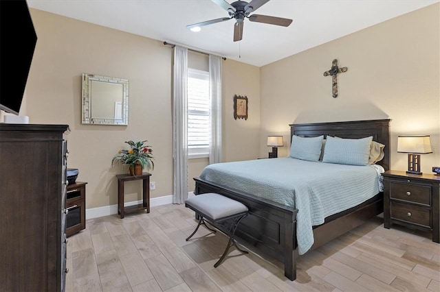 bedroom featuring ceiling fan and light hardwood / wood-style floors