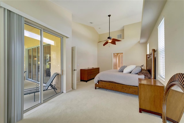 carpeted bedroom featuring multiple windows, high vaulted ceiling, access to outside, and ceiling fan