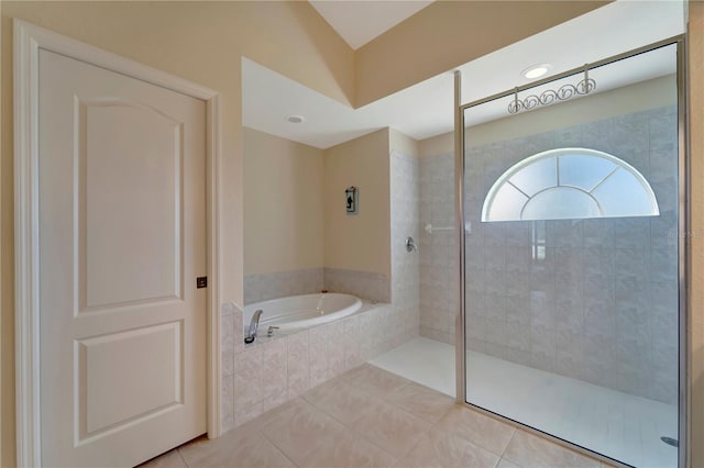 bathroom with tile patterned floors and separate shower and tub