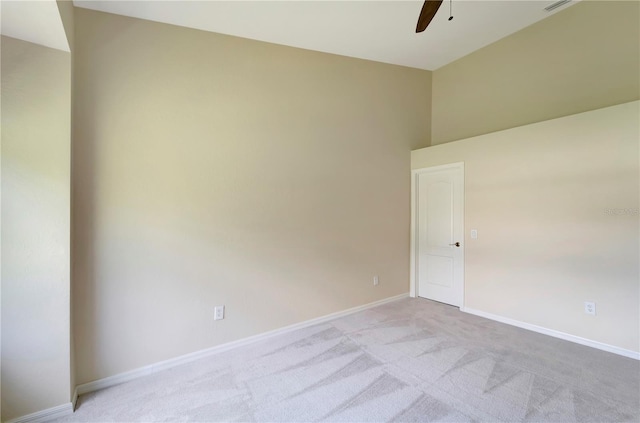 unfurnished room featuring ceiling fan and light carpet