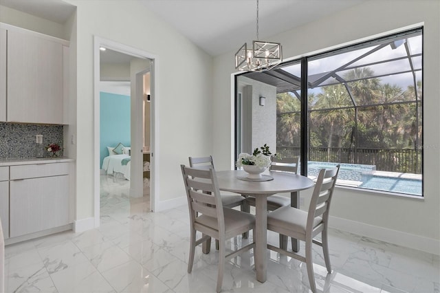 dining area with plenty of natural light and lofted ceiling