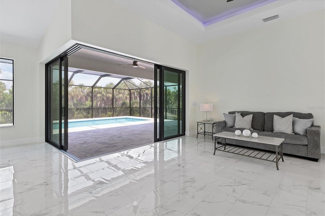 doorway to outside featuring marble finish floor, baseboards, visible vents, and a sunroom