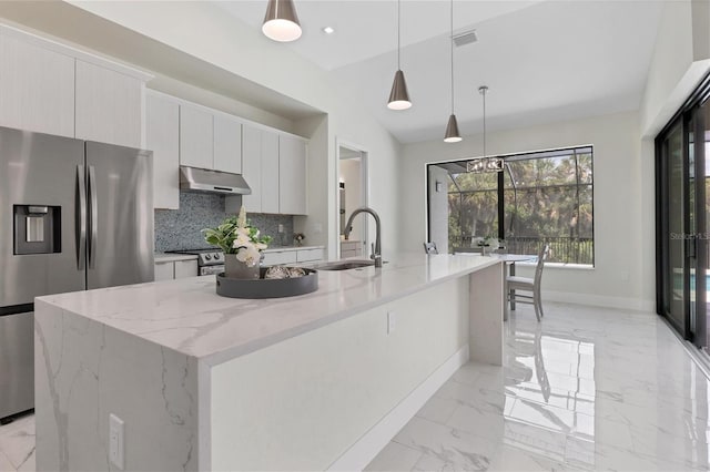 kitchen with marble finish floor, stainless steel appliances, a sink, modern cabinets, and under cabinet range hood