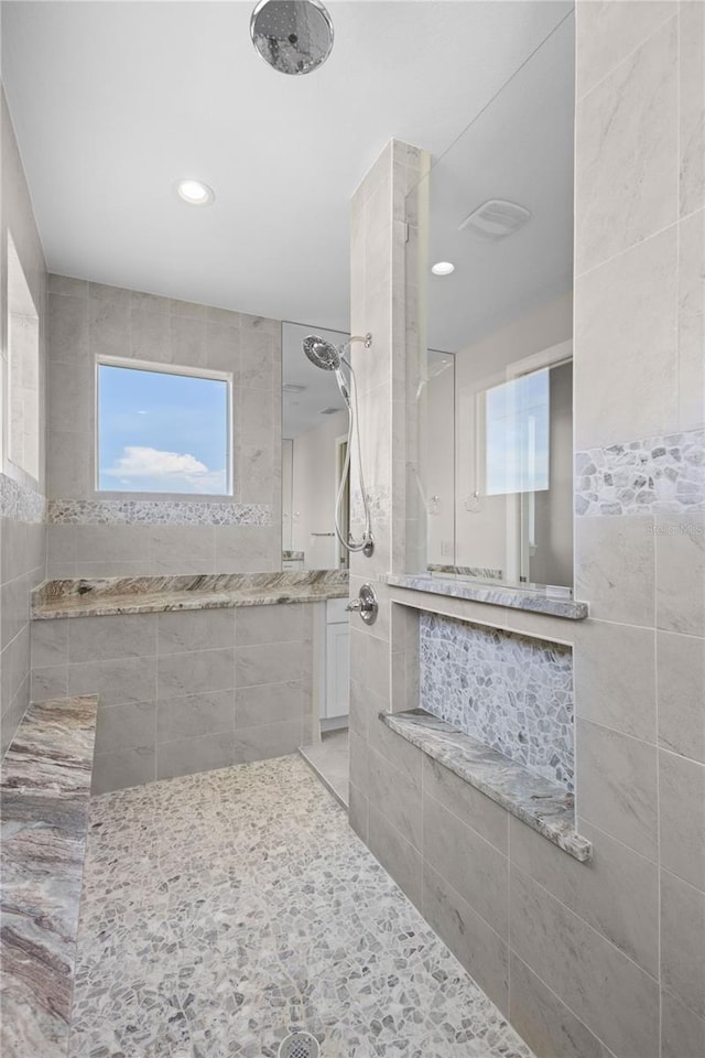 bathroom with tiled shower