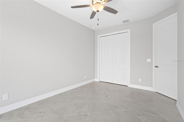 unfurnished bedroom with a closet and ceiling fan