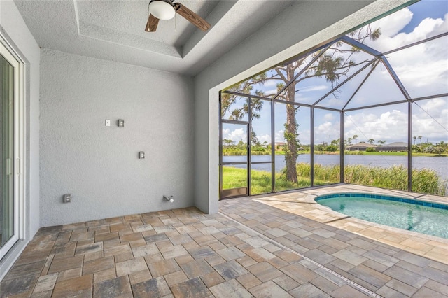 view of pool featuring a water view, a lanai, and a patio