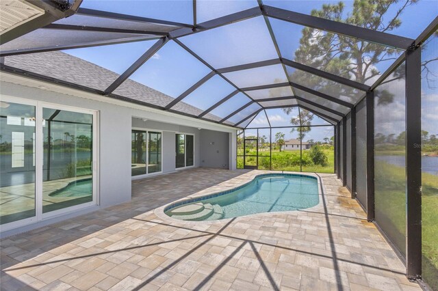 view of pool with a patio and a lanai