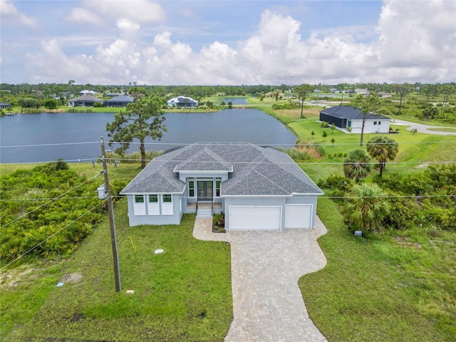 birds eye view of property with a water view