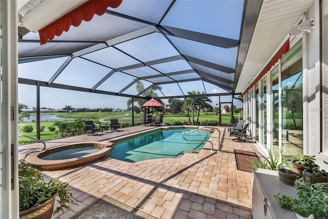 view of swimming pool featuring glass enclosure, a patio area, and an in ground hot tub