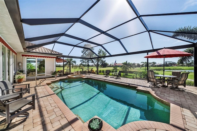 view of swimming pool featuring glass enclosure and a patio