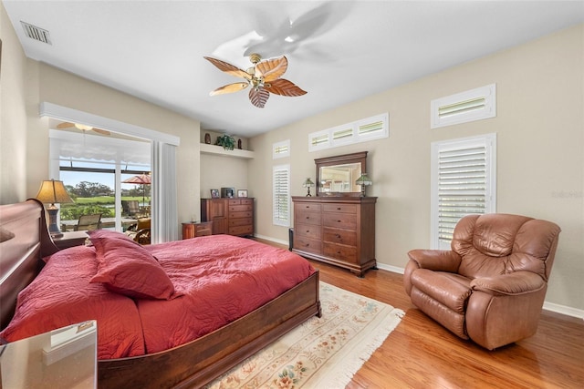 bedroom featuring ceiling fan, access to outside, and wood-type flooring