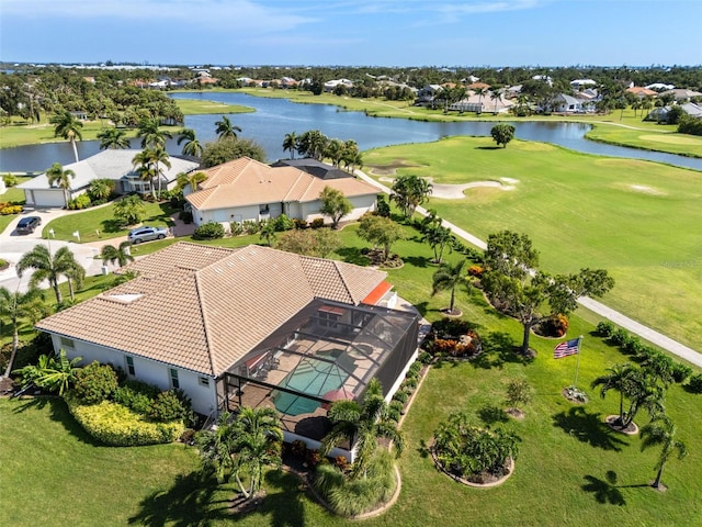 bird's eye view featuring a water view, view of golf course, and a residential view