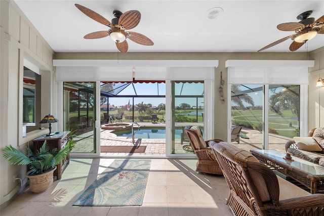 sunroom with ceiling fan