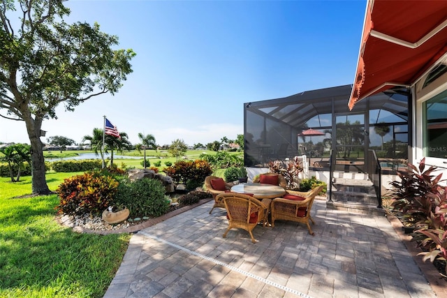 view of patio with glass enclosure